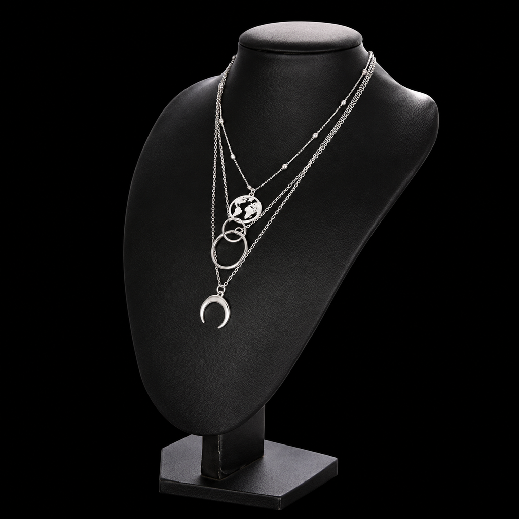 Silver layered necklace on black jewelry display bust